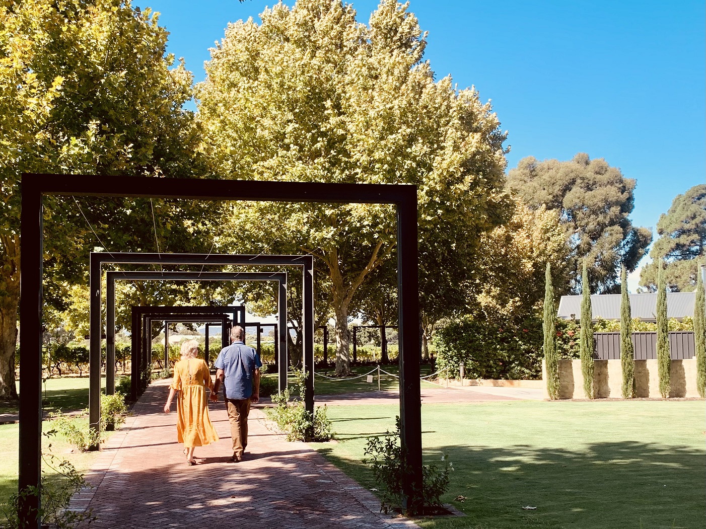 Mothers Day couple walking under arches horizontal